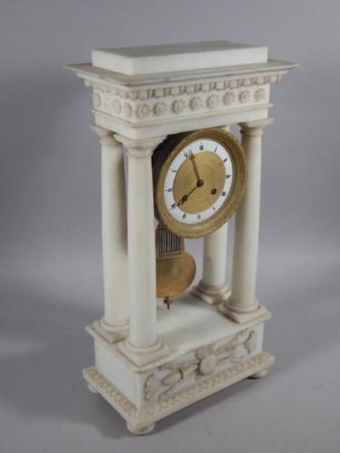 A French marble and gilt metal Portico type clock