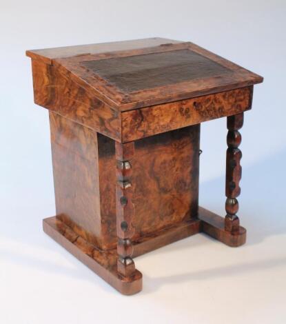 An early 20thC burr walnut veneered apprentice Davenport desk