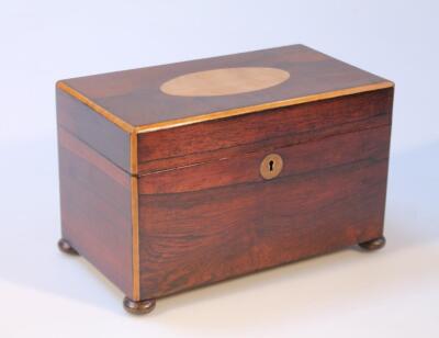 An early 19thC rosewood satinwood and mahogany tea caddy