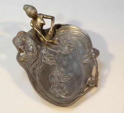 An Art Nouveau metal waiter