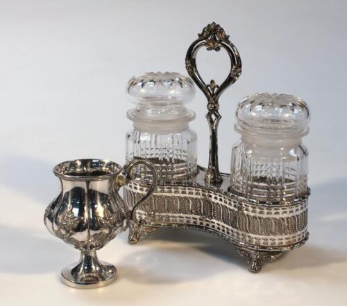 An Edwardian silver plated and glass jar set