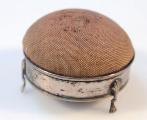 An Edwardian silver and material pin cushion