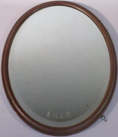 An early 20thC LNER wall mirror