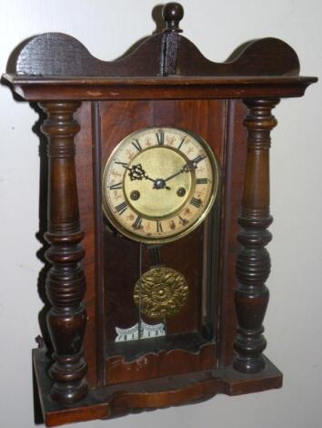 An early 20thC walnut and stained beech Vienna style wall clock