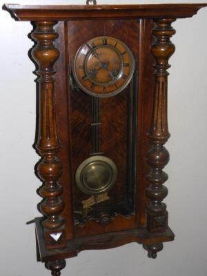 A late 19thC walnut cased Vienna wall clock