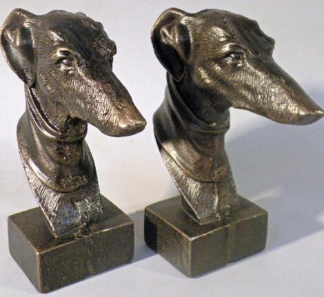 *Two cast greyhound heads