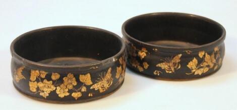 A pair of 19thC papier mache coasters