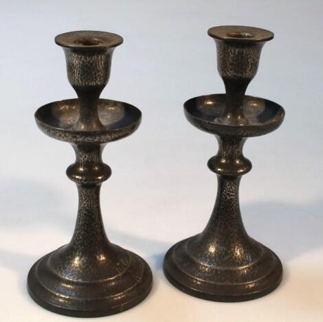 A pair of early 20thC Arts and Crafts Unity pewter candlesticks