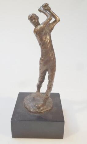 A spelter figure of a standing golfer