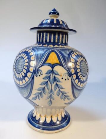 A Portuguese tin glazed faience jar and cover