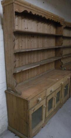 A stripped and lightly polished reclaimed pine dresser