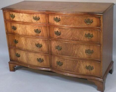 A 20thC serpentine fronted double chest of drawers