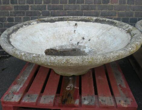 A large concrete Mexican hat style garden planter