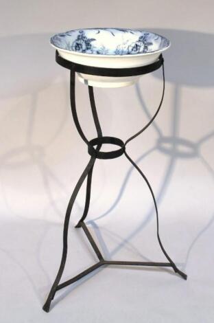 An early 20thC wrought iron wash bowl stand