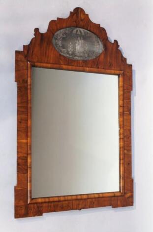 A 18thC style walnut framed wall mirror