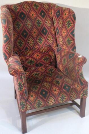 *A late 19thC/ early 20thC mahogany framed wing armchair