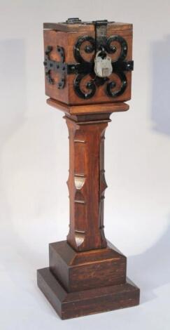 An early 20thC oak offertory box