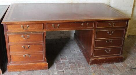 A 20thC mahogany partner's desk