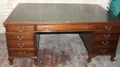 A 20thC mahogany partner's desk