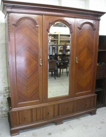 An Edwardian mahogany triple wardrobe