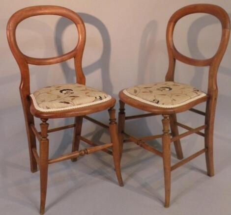 A pair of Victorian mahogany balloonback salon chairs