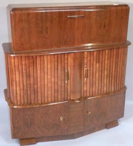 A mid-20thC walnut cocktail cabinet