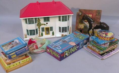 A 20thC metal and plastic doll's house