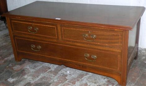 An Edwardian mahogany low chest