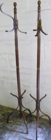 A matched pair of beech bentwood coat stands