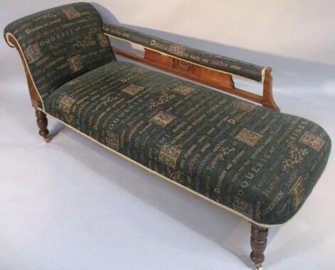 An Edwardian carved oak chaise longue