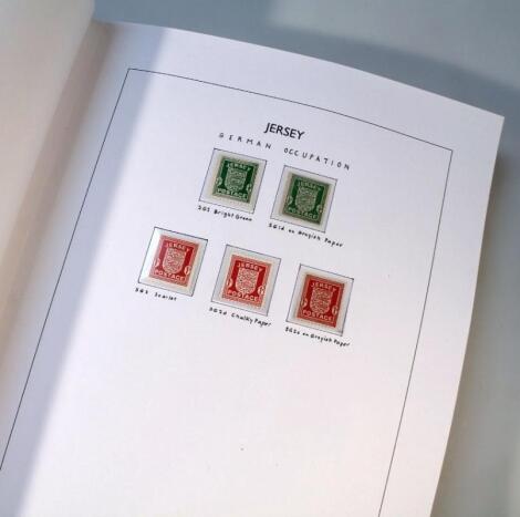 Three Jersey stamp albums