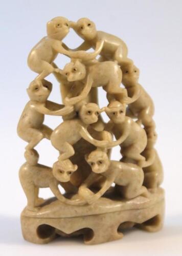 A 20thC polished soapstone figure group