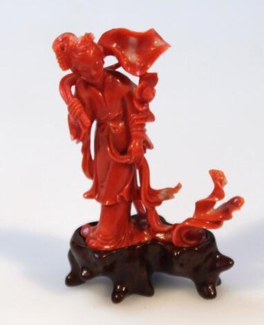 A finely carved Chinese coral figure