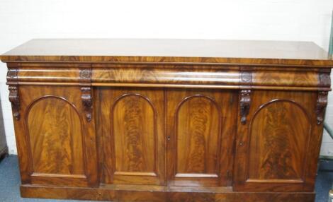 A Victorian flamed mahogany sideboard