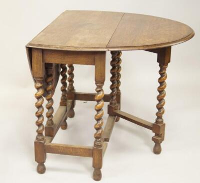 A 1930's oak barleytwist gateleg dining table.