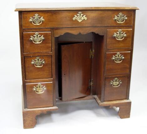 A George III mahogany kneehole dressing table or desk