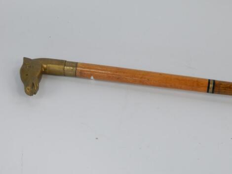 A brass horse headed collapsible walking stick