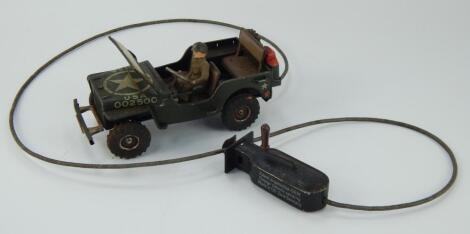 An Arnold 2500 tin plate cable controlled US military jeep.