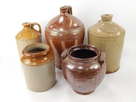 A collection of stoneware bottles