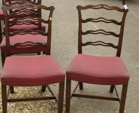 A set of seven (including carver) reproduction Chippendale pierced ladderback dining chairs