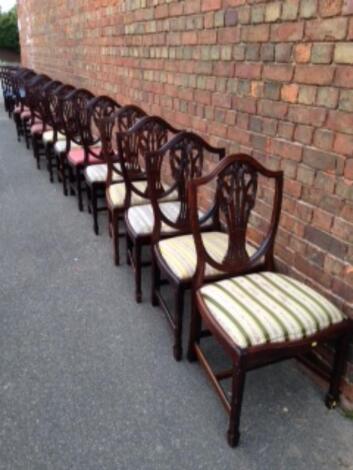 A set of thirteen reproduction shield back dining chairs