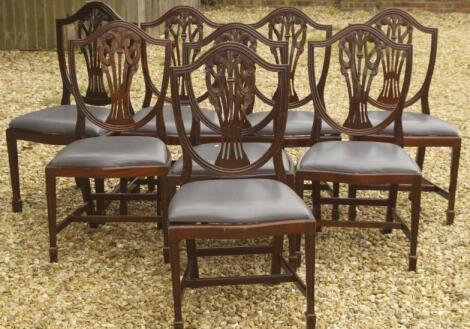 A set of eight reproduction mahogany shield back dining chairs