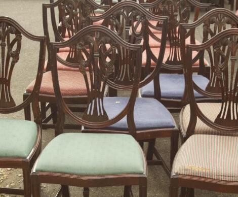 A Harlequin set of twenty seven reproduction mahogany shield back dining chairs