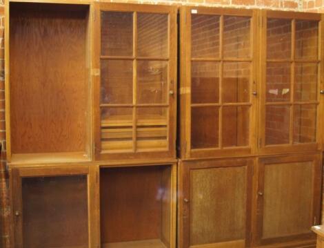 Two mid 20thC light oak glazed bookcases