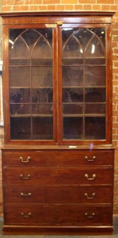 An early 19thC mahogany cabinet bookcase