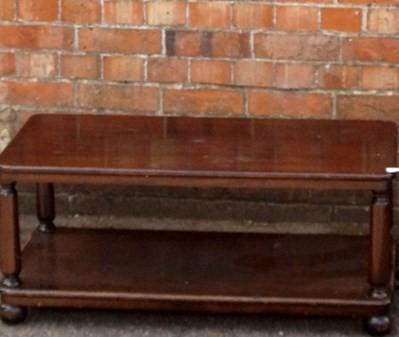 A heavy mahogany rectangular coffee table