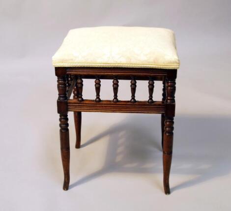 A late Victorian beech dressing or piano stool.