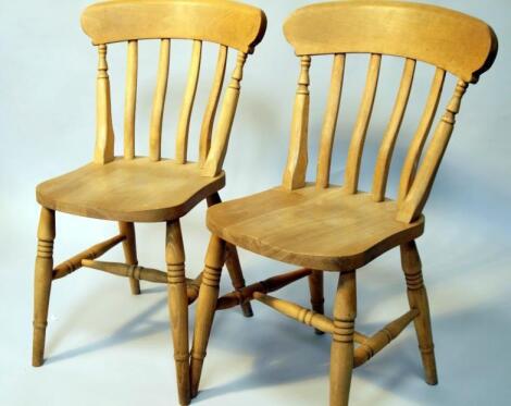 A set of four Victorian style beech lath back kitchen chairs.