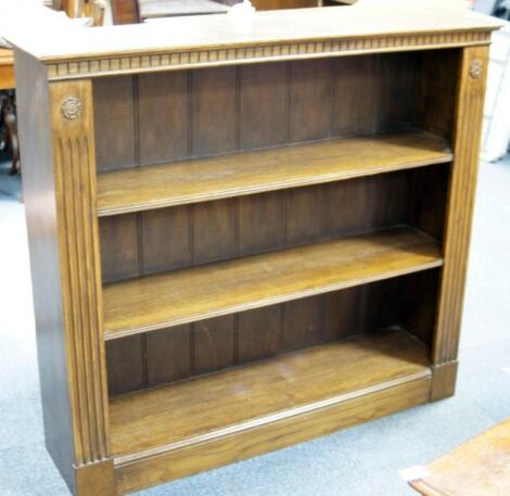 A reproduction oak open bookcase