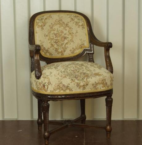 A 19thC French carved walnut fauteuil